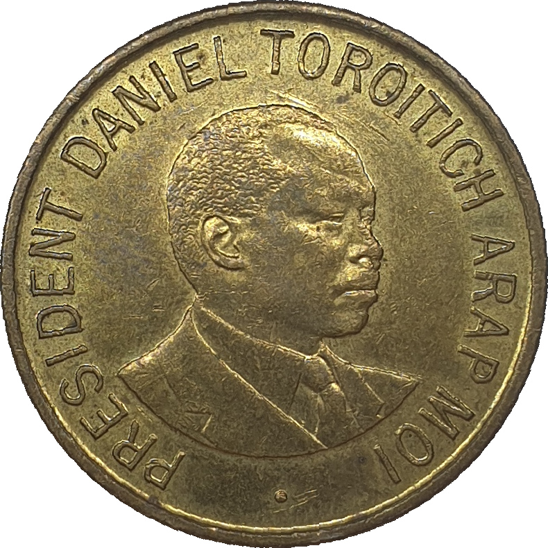 1 shilling - Daniel Toroitich - Small Arms - Brass plated steel